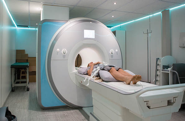 Female patient lies and waits for her MRI scan