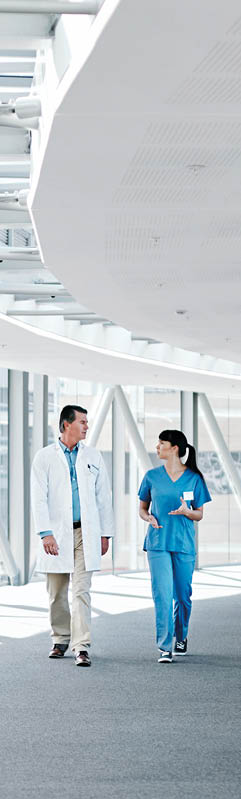 Shot of two healthcare workers walking together